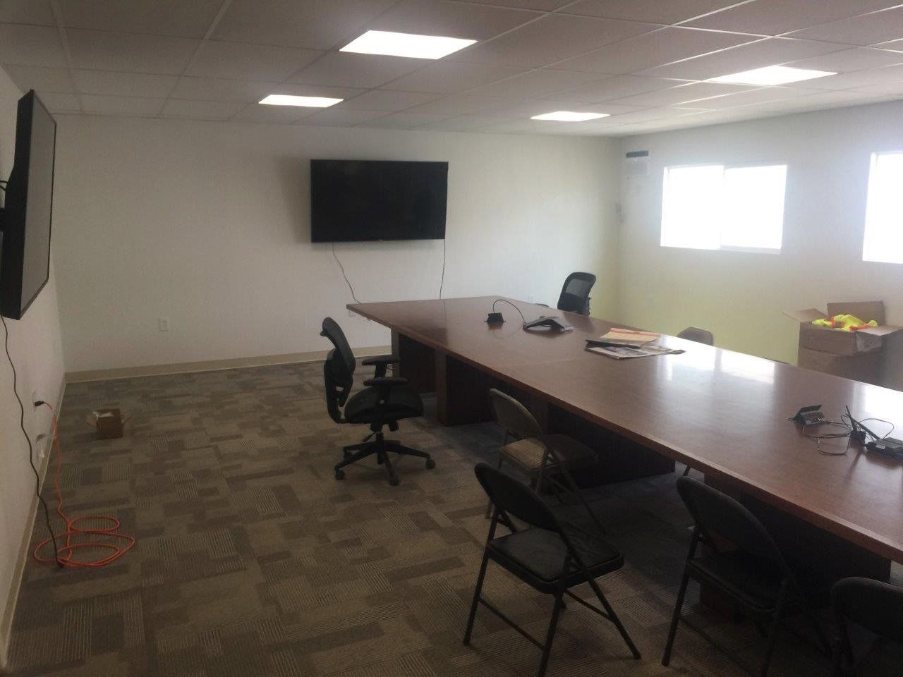 Multi-wide container office interior with meeting table