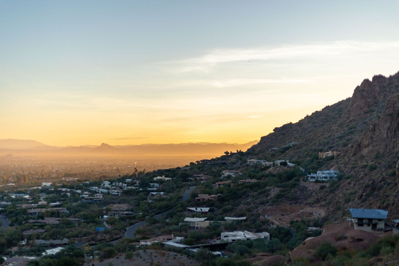 Phoenix, Arizona skyline against desert hills at sunset