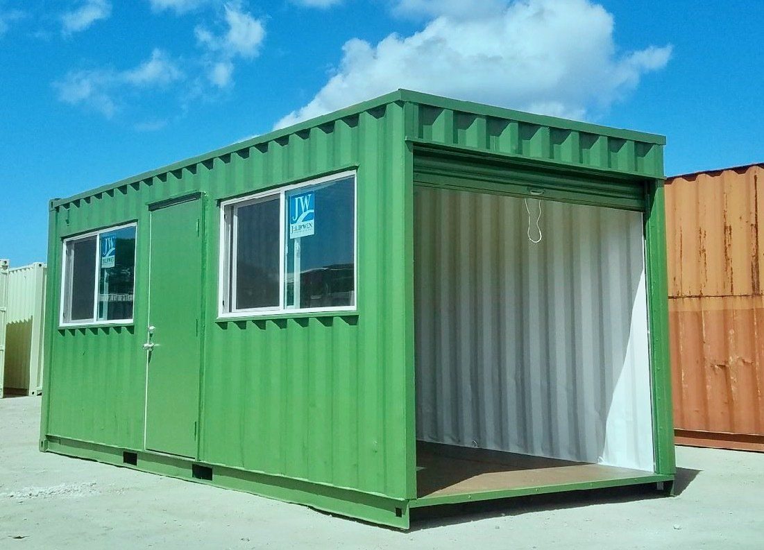 Container with a roll-up door, personnel door, and windows